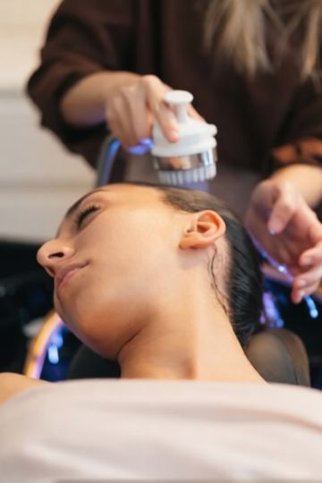 woman finishing up her scalp treatment for hair loss in Beverly Hills Head Spa