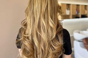 woman getting layered haircut and style in Los Angeles Salon