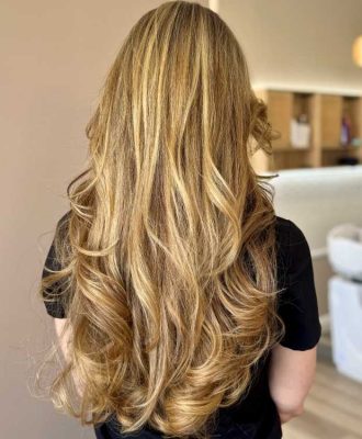 woman getting layered haircut and style in Los Angeles Salon