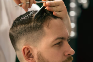 fresh-style-close-up-client-master-barber-stylist-getting-care-new-look-hairstyle-professional-occupation-male-beauty-self-care-concept-soft-colors-focus-vintage_155003-45364