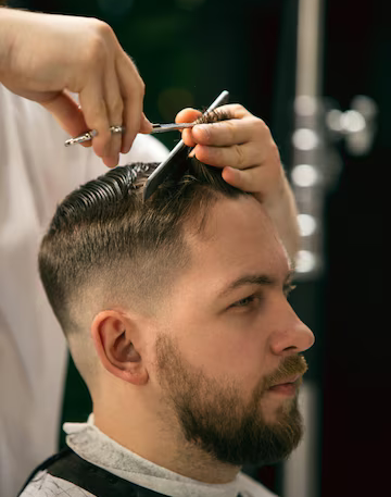 fresh-style-close-up-client-master-barber-stylist-getting-care-new-look-hairstyle-professional-occupation-male-beauty-self-care-concept-soft-colors-focus-vintage_155003-45364