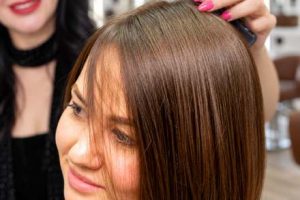 Stylist styling a client's bob haircut near Beverly Hills