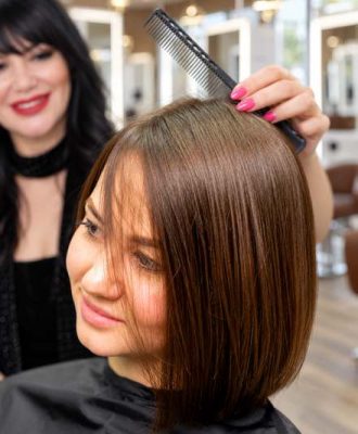 Stylist styling a client's bob haircut near Beverly Hills
