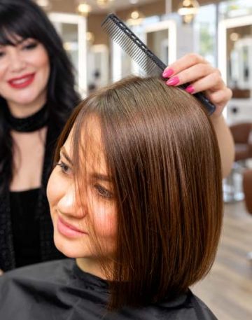 Stylist styling a client's bob haircut near Beverly Hills