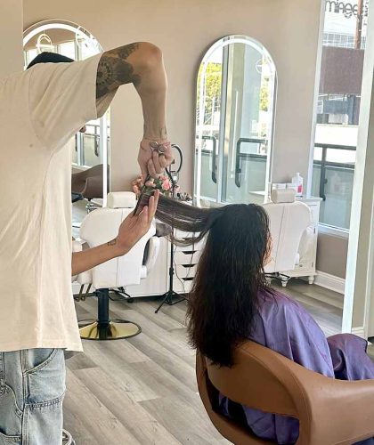 Woman with a long layered haircut at a Los Angeles hair salon