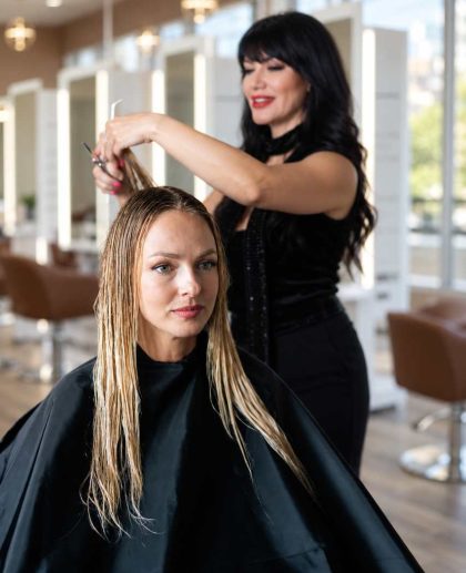 Woman with a long layered haircut at a West Hollywood hair salon