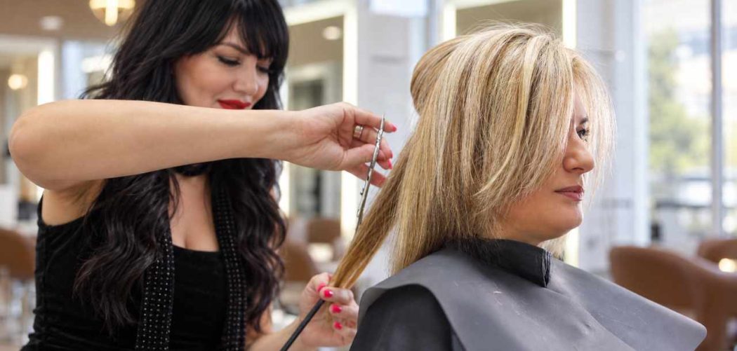 Woman with a finished layered haircut at Gloss & Glam in Los Angeles